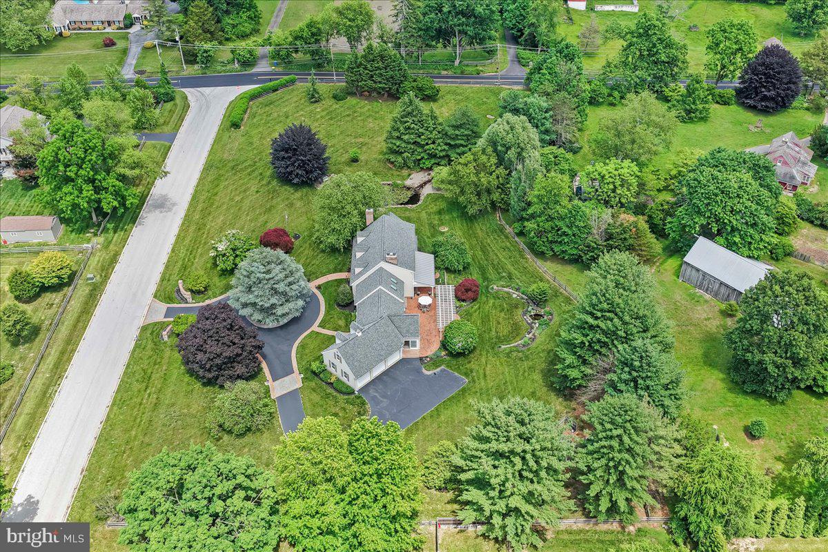 7 Bolingbroke Road West Chester, PA 19382 - Photo 56 of 86 Lush greenery surrounds a charming home.