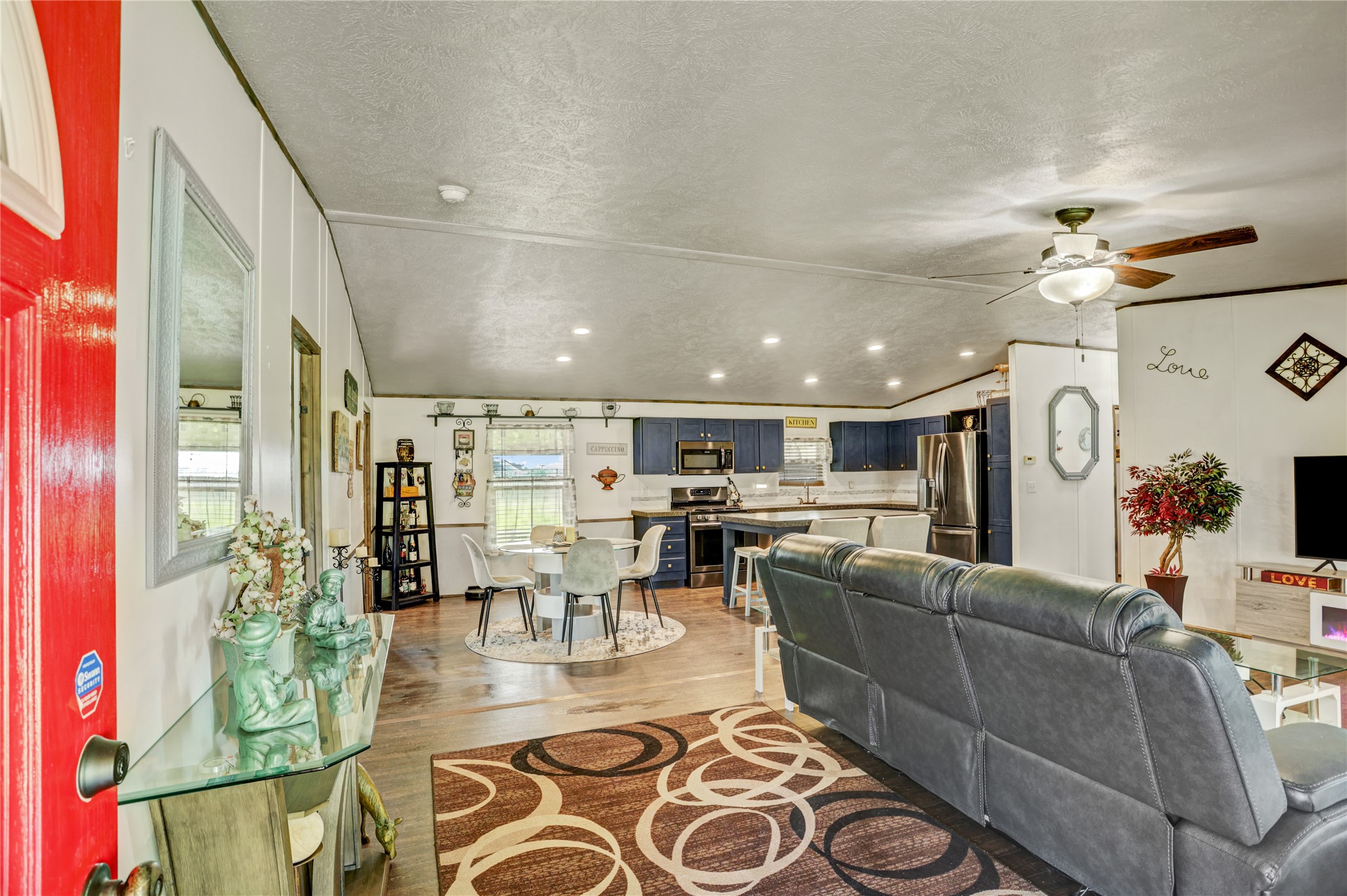 2811 Pisces Street Rosenberg, TX 77469 - Photo 11 of 34 Bright open-concept living area with a modern kitchen and dining space.