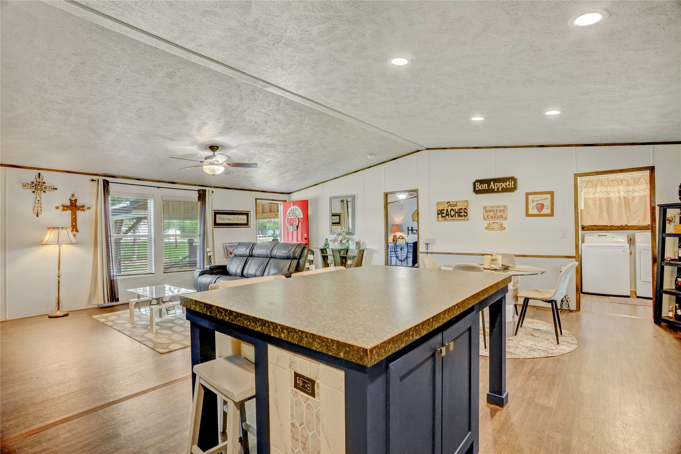 2811 Pisces Street Rosenberg, TX 77469 - Photo 14 of 34 The room is well-lit with recessed lighting and large windows.