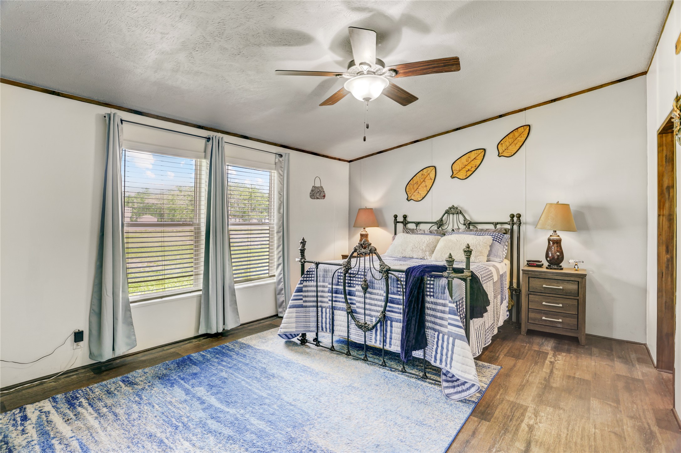 2811 Pisces Street Rosenberg, TX 77469 - Photo 17 of 34 Primary bedroom features high ceilings, ceiling fan, and carpet-free flooring.