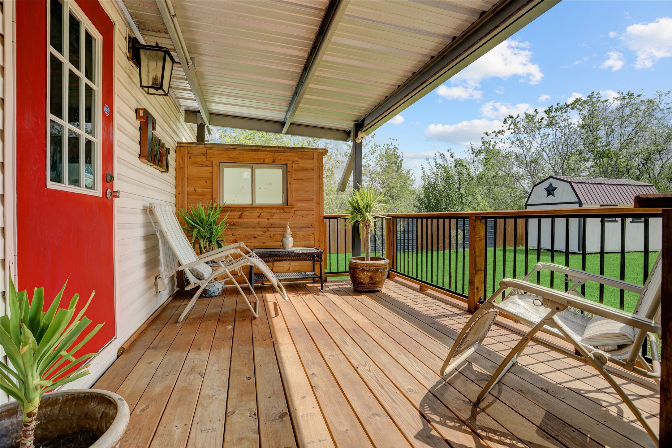 2811 Pisces Street Rosenberg, TX 77469 - Photo 24 of 34 Spacious backyard with a covered patio and wooden deck, ideal for outdoor activities.