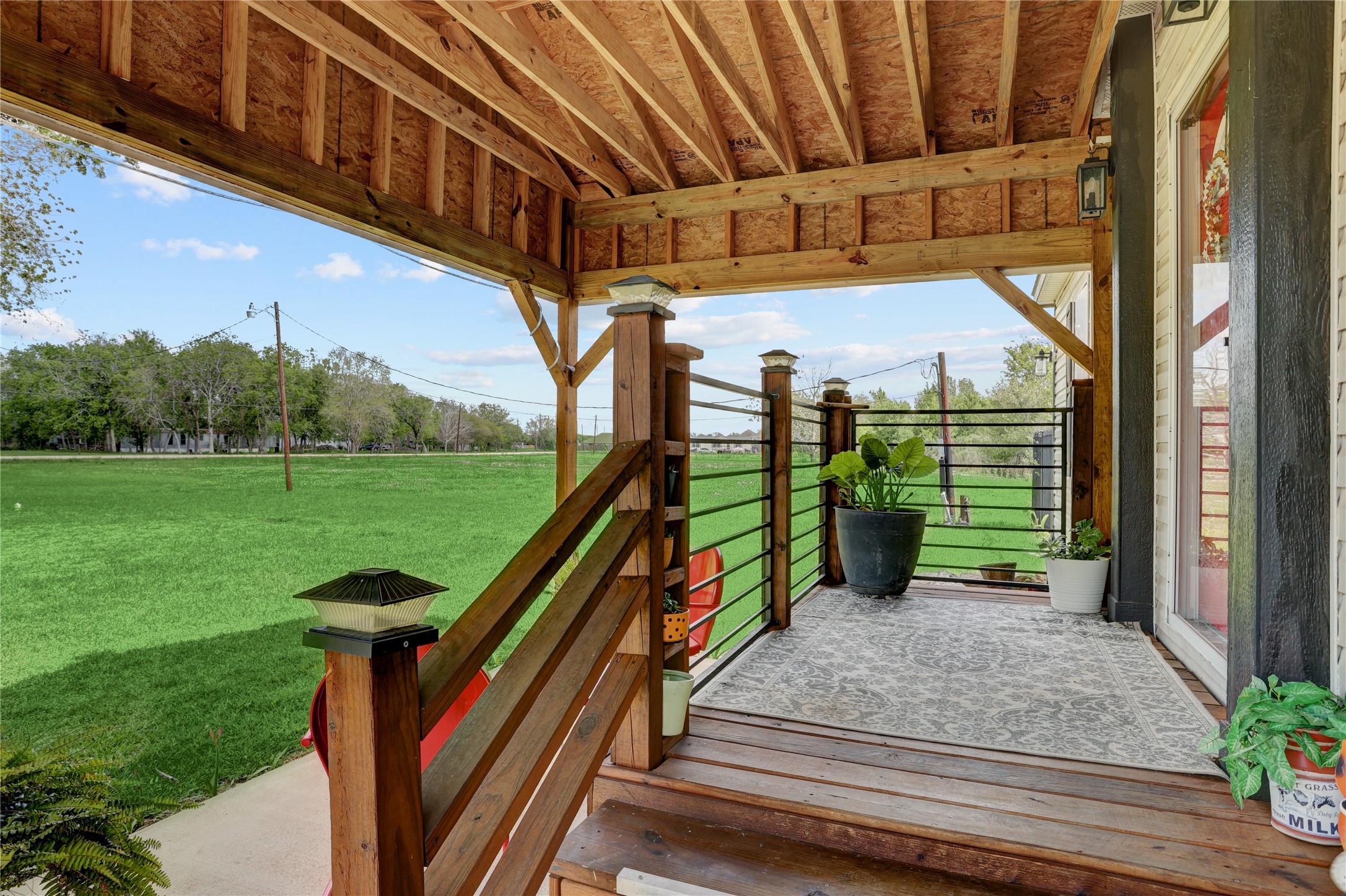 2811 Pisces Street Rosenberg, TX 77469 - Photo 10 of 34 Porch with wooden railings.