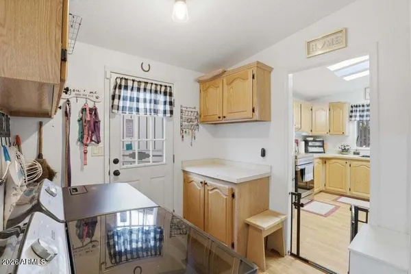 a kitchen with a sink appliances and cabinets