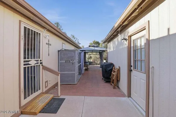 a view of a porch with wooden floor and stairs