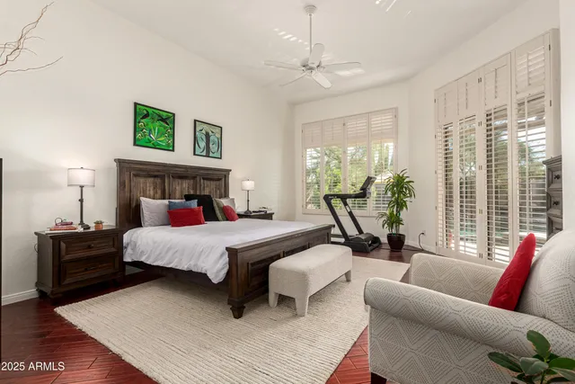 a bedroom with a large bed and a couch