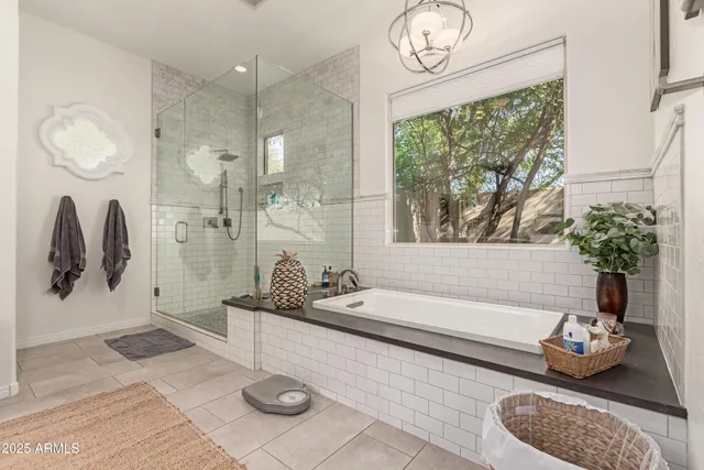 a bathroom with a granite countertop sink a toilet and bathtub