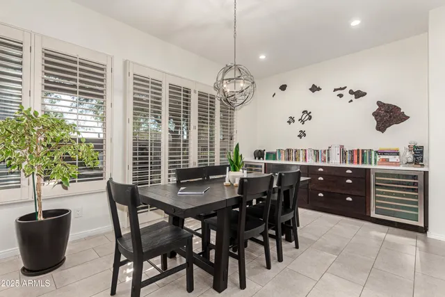 a dining room with furniture and window