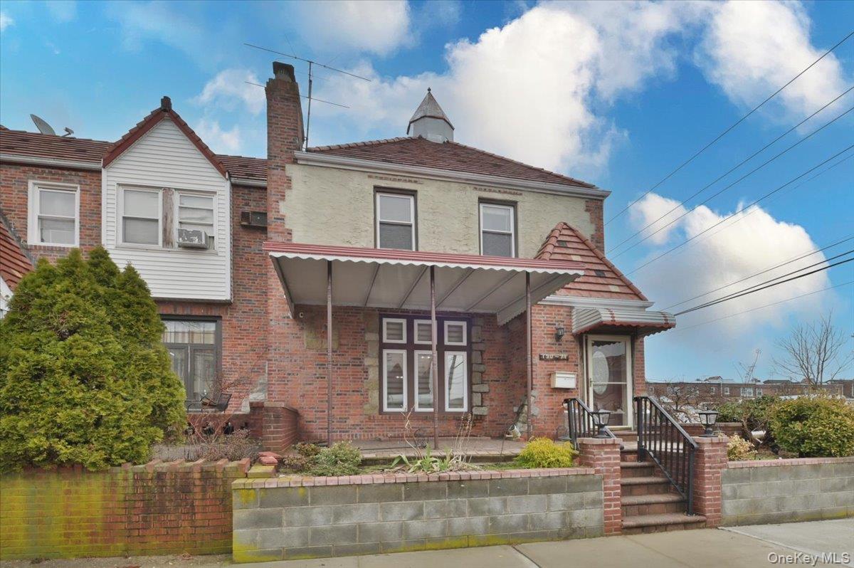 130-71 225th Street Queens, NY 11413 - Photo 1 of 26 a front view of a house with swimming pool and glass windows