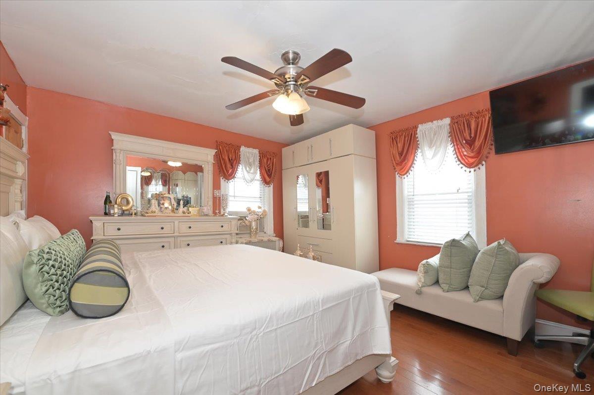 130-71 225th Street Queens, NY 11413 - Photo 17 of 26 a bedroom with a bed and window