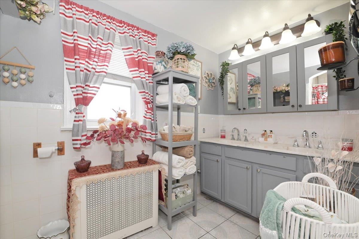 130-71 225th Street Queens, NY 11413 - Photo 26 of 26 a kids room with furniture and a chandelier