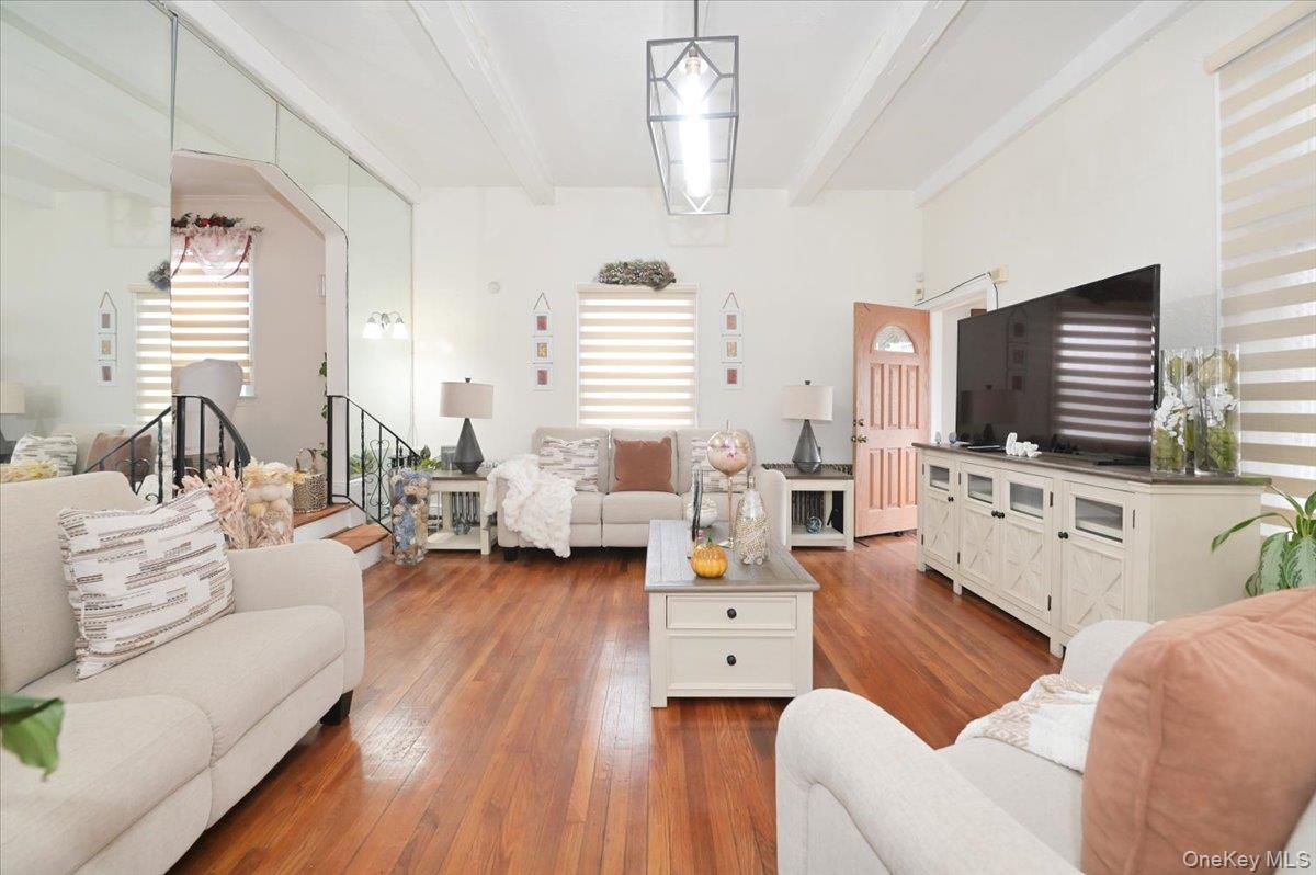 130-71 225th Street Queens, NY 11413 - Photo 3 of 26 a living room with furniture and a flat screen tv