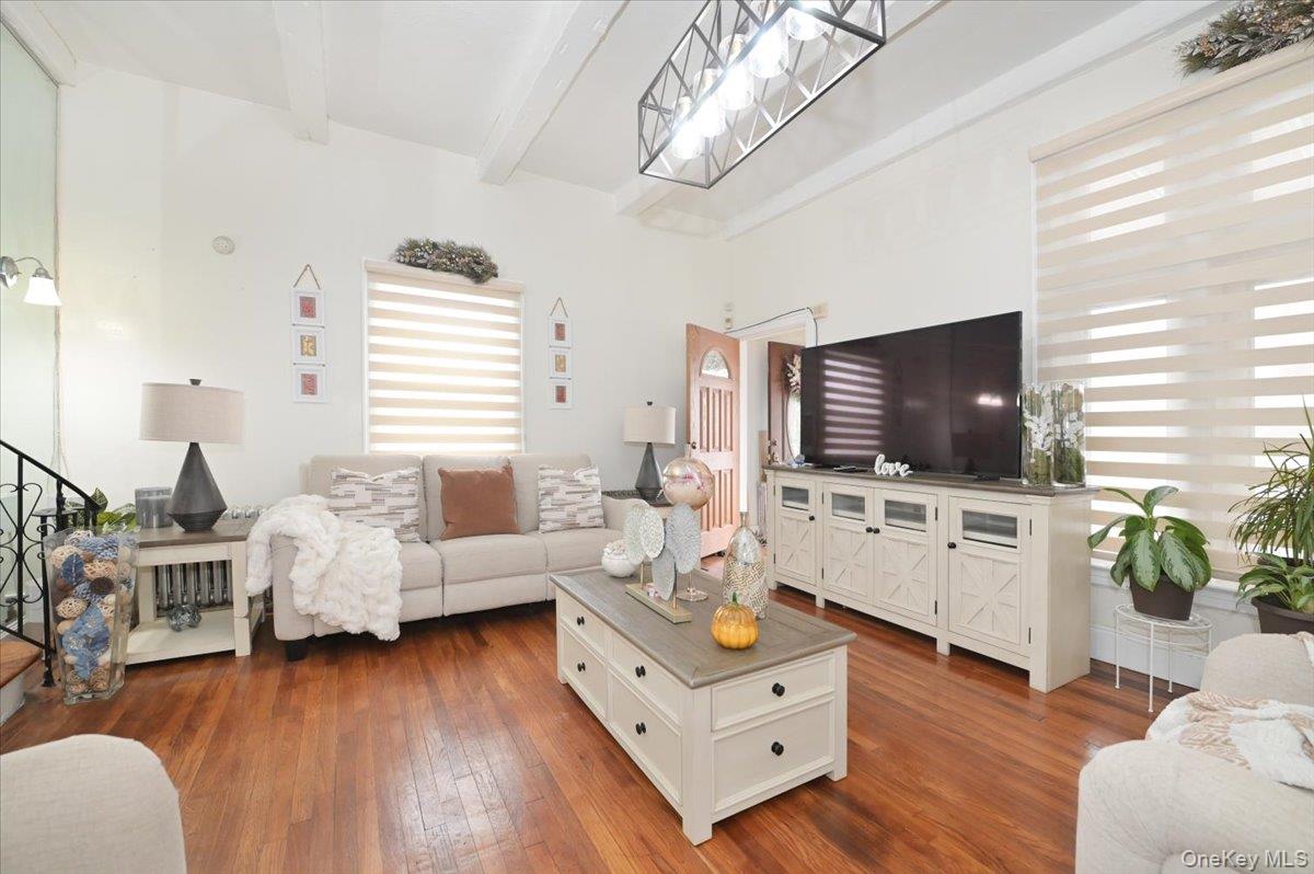 130-71 225th Street Queens, NY 11413 - Photo 6 of 26 a living room with furniture and a flat screen tv