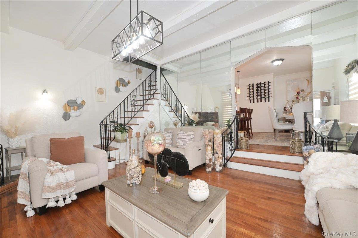 130-71 225th Street Queens, NY 11413 - Photo 8 of 26 a living room with furniture and a wooden floor