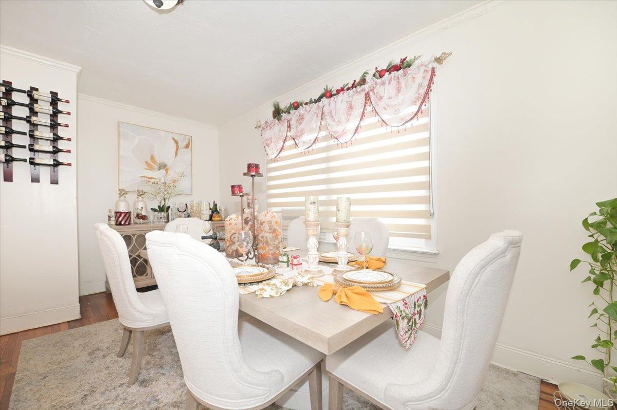 130-71 225th Street Queens, NY 11413 - Photo 9 of 26 a view of a dining room with furniture and window