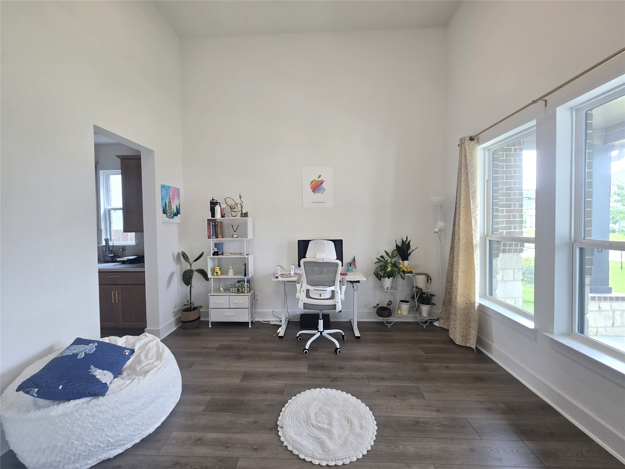 124 Ribera Drive Liberty Hill, TX 78642 - Photo 7 of 40 High ceilings elevate this flexible space, perfect for an office with plentiful natural light.
