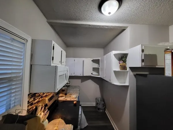 a room with furniture and wooden floor