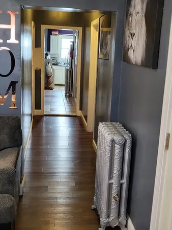 a bedroom with a bed and a lamp