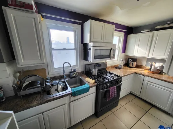 a room with furniture and wooden floor