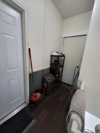 a utility room with dryer washer and other items