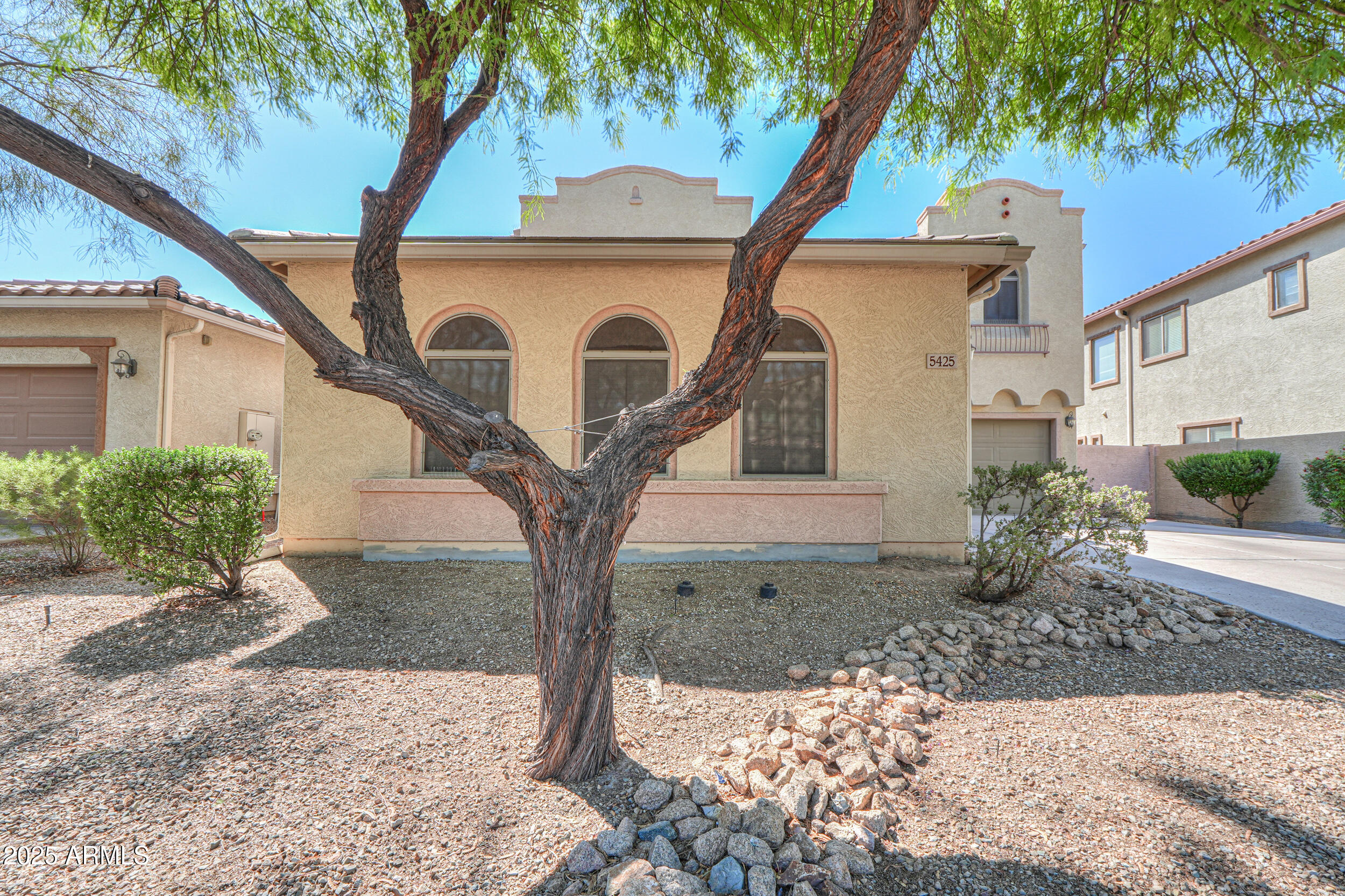 5425 West Harwell Road Laveen, AZ 85339 - Photo 3 of 49 a front view of a house with garden
