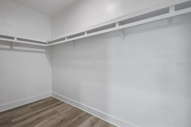 a view of an empty walk in closet