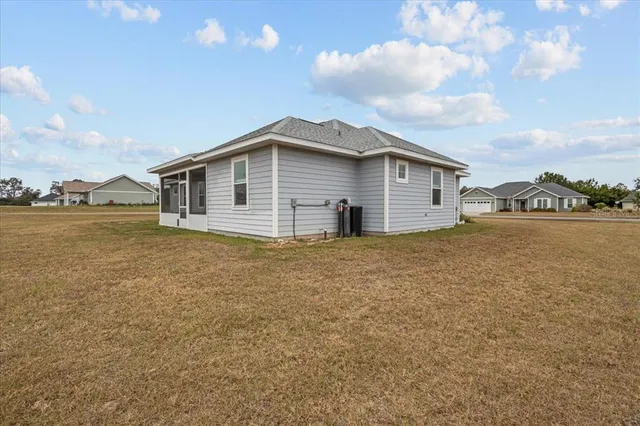 a big house with a big yard and large trees