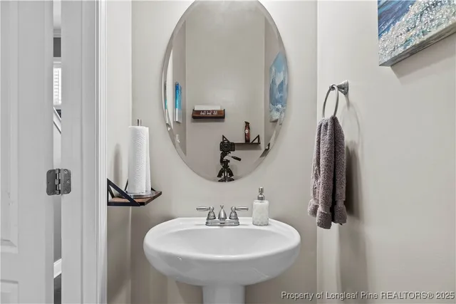 a bathroom with a sink and mirror