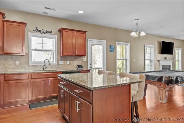 a kitchen with a sink stove and microwave
