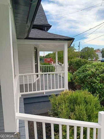 a view of a brick house with a large window