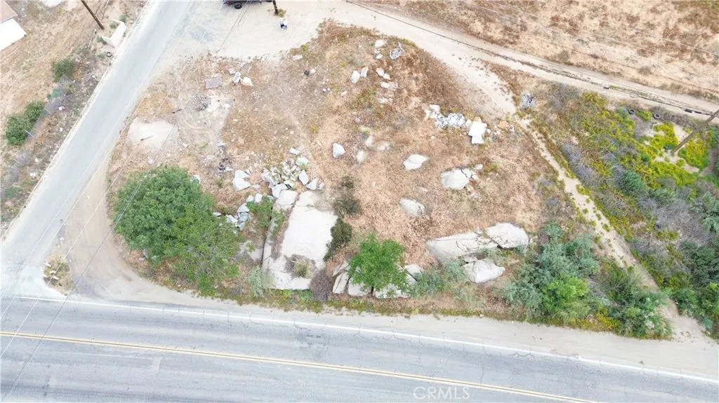 0 Old Elsinore Road, Unit 10 Perris, CA 92570 - Photo 9 of 11 a white house with a street view