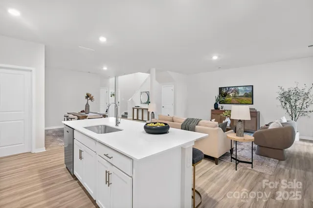 a kitchen with sink and cabinets
