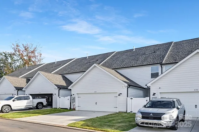 a big house with a big yard and large trees