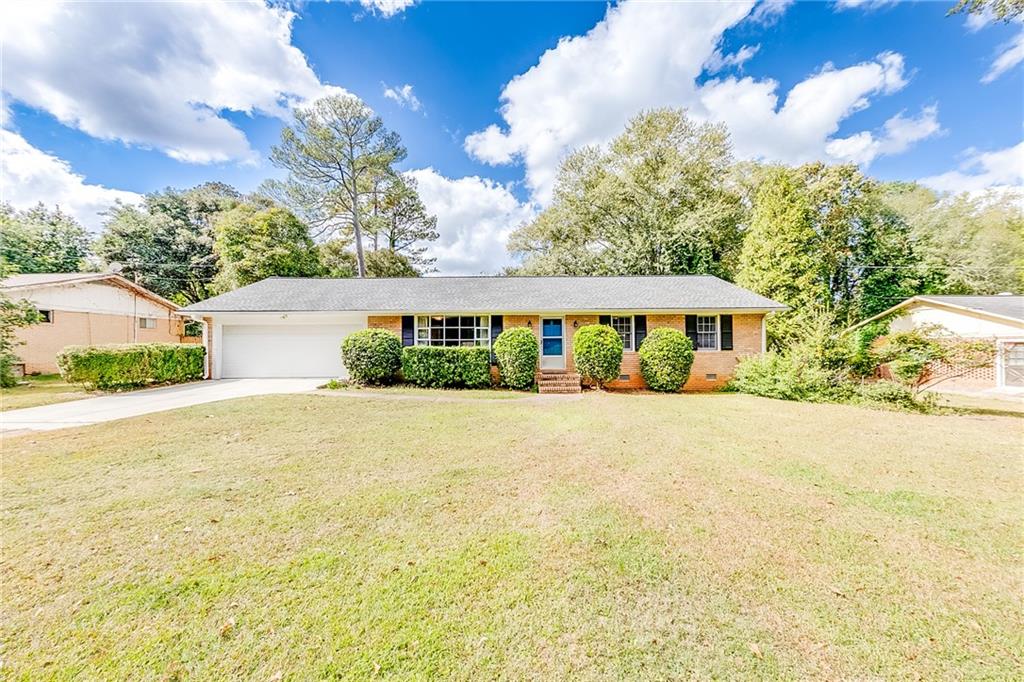 536 Cherokee Ridge Athens, GA 30606 - Photo 1 of 1 a front view of house with yard and trees in the background