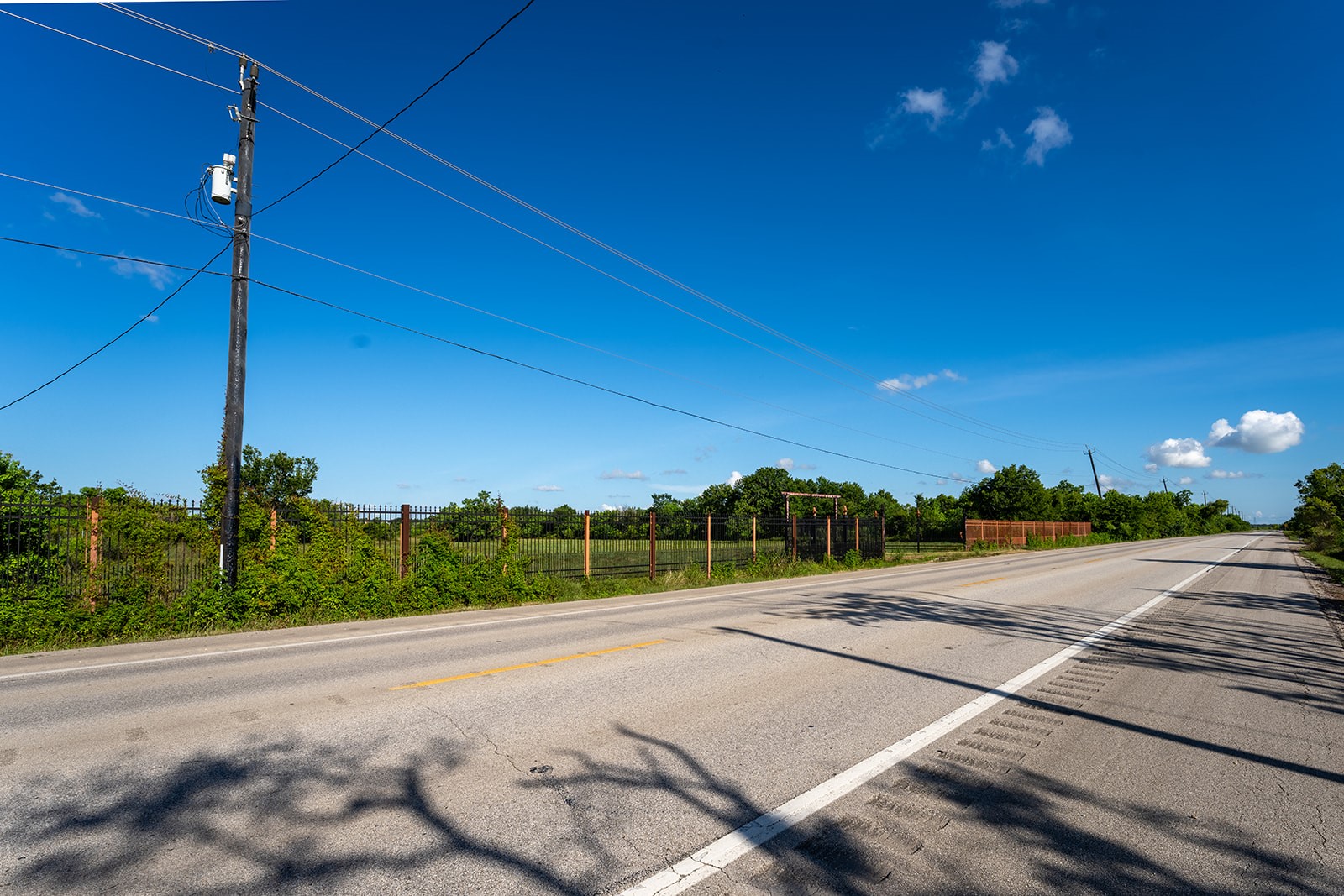11030 Farm To Market Road 523 Angleton, TX 77515 - Photo 5 of 10 a view of a street with a yard