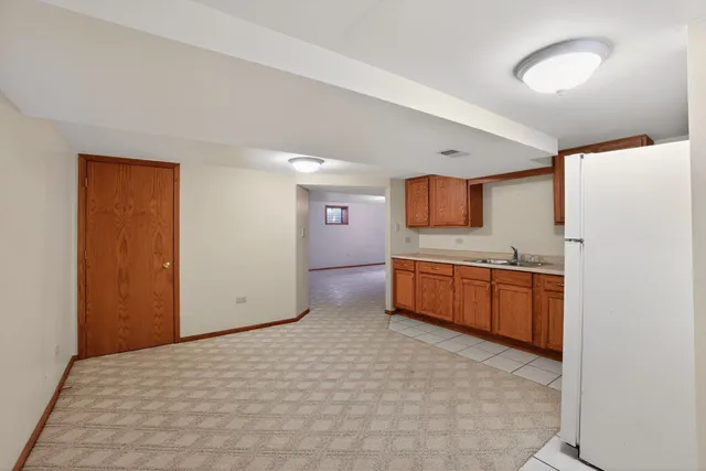 a kitchen with stainless steel appliances a refrigerator and a sink