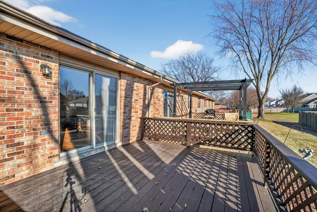 a view of a wooden chairs on the deck