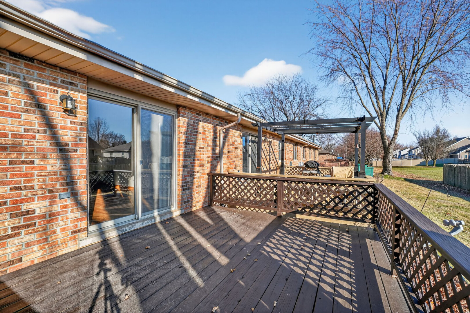 102 Wyndstone Drive Elwood, IL 60421 - Photo 3 of 31 a view of a wooden chairs on the deck