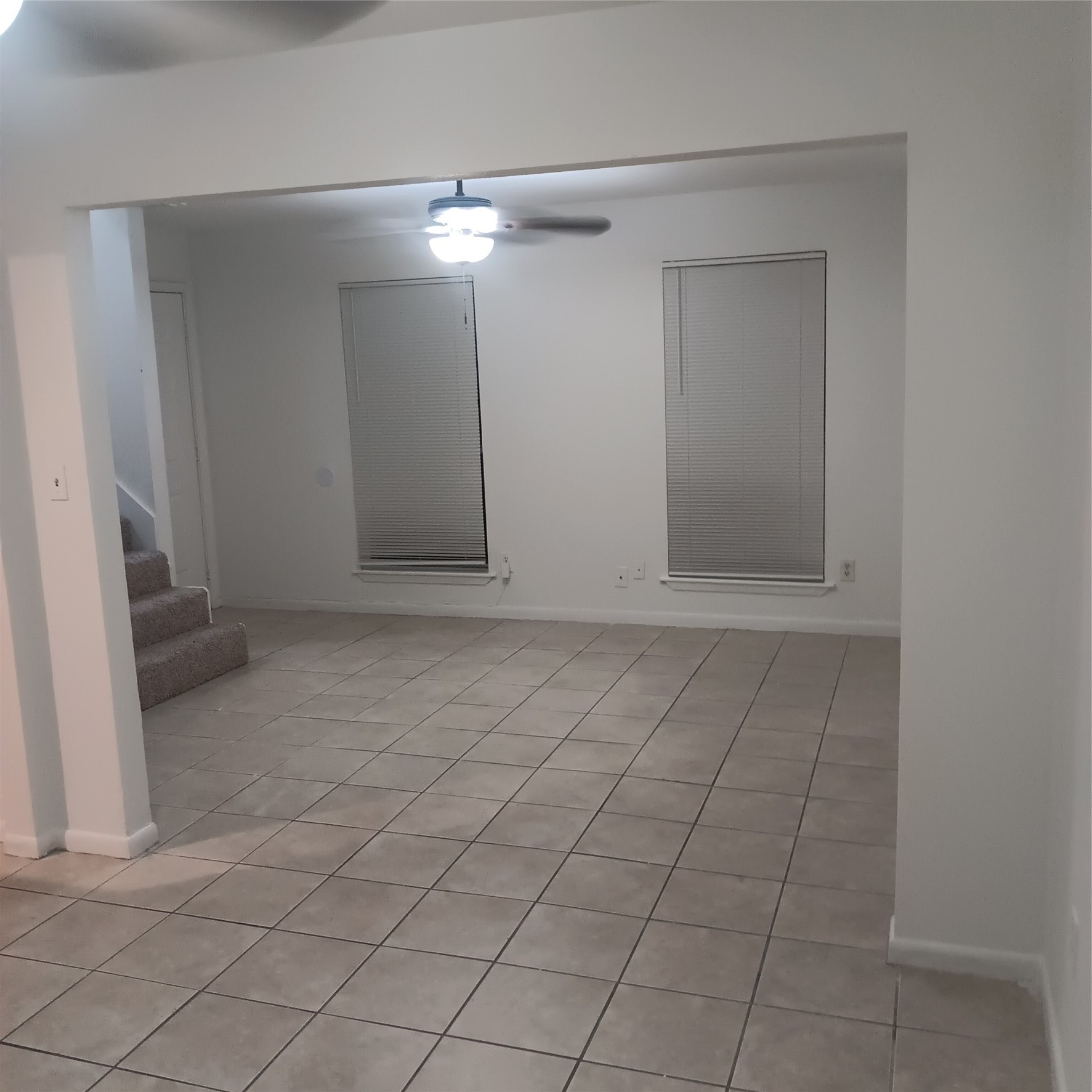 521 Ferguson Street, Unit B1 Humble, TX 77338 - Photo 4 of 7 an empty room with fan