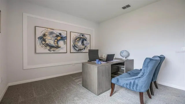 a living room with furniture a fireplace and wooden floors