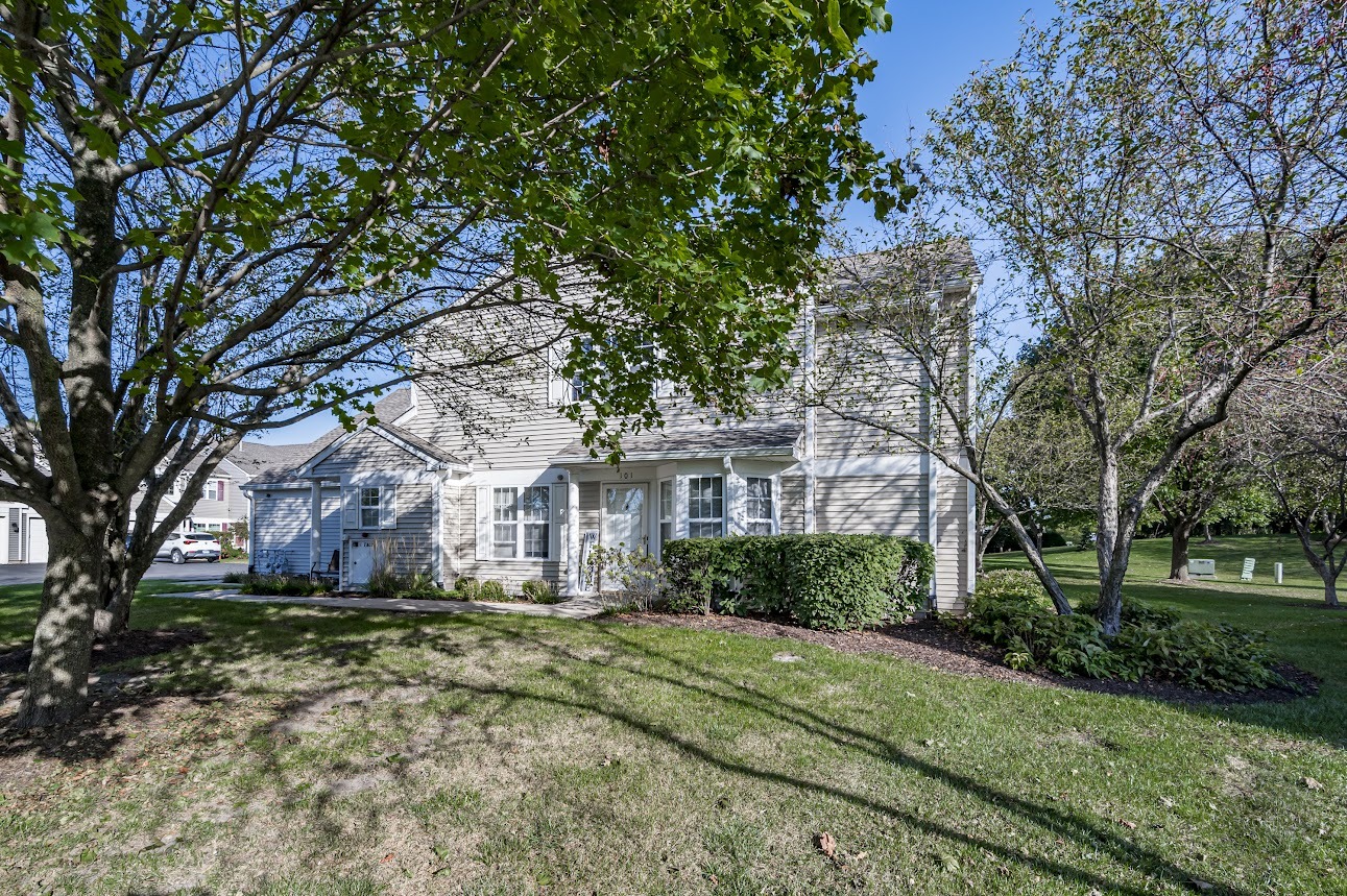 2827 Rutland Circle, Unit 101 Naperville, IL 60564 - Photo 24 of 25 a front view of a house with a yard