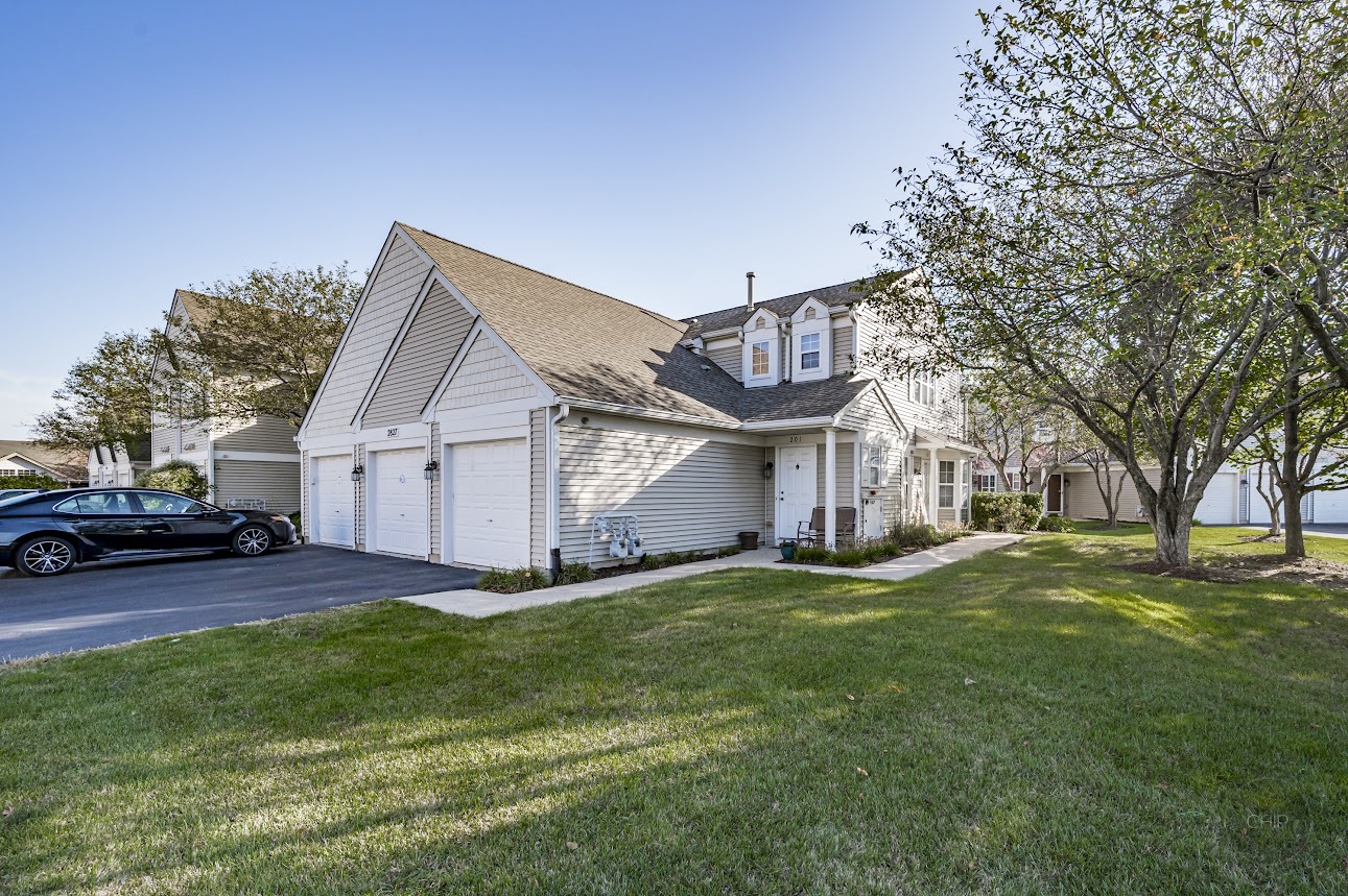 2827 Rutland Circle, Unit 101 Naperville, IL 60564 - Photo 25 of 25 a view of a house with a yard