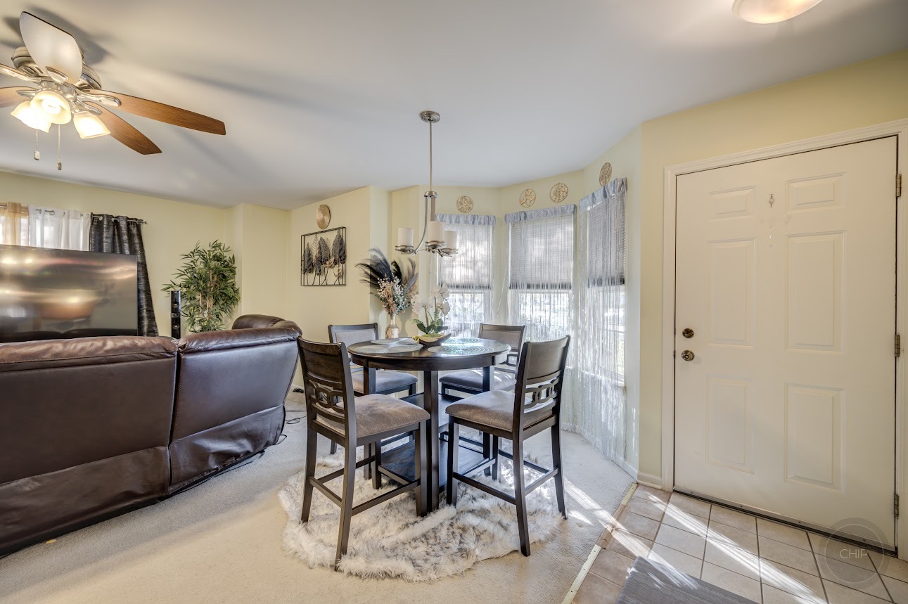 2827 Rutland Circle, Unit 101 Naperville, IL 60564 - Photo 9 of 25 a dining room with furniture and window
