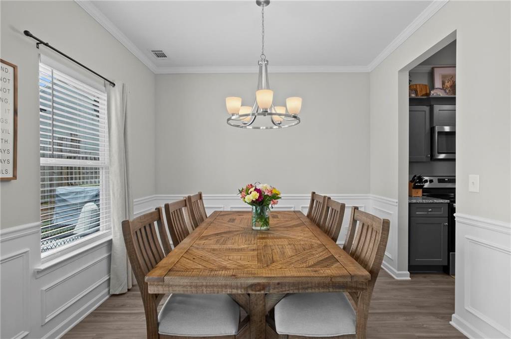 217 Eva Way Cartersville, GA 30121 - Photo 13 of 27 a view of a dining room with furniture wooden floor and chandelier