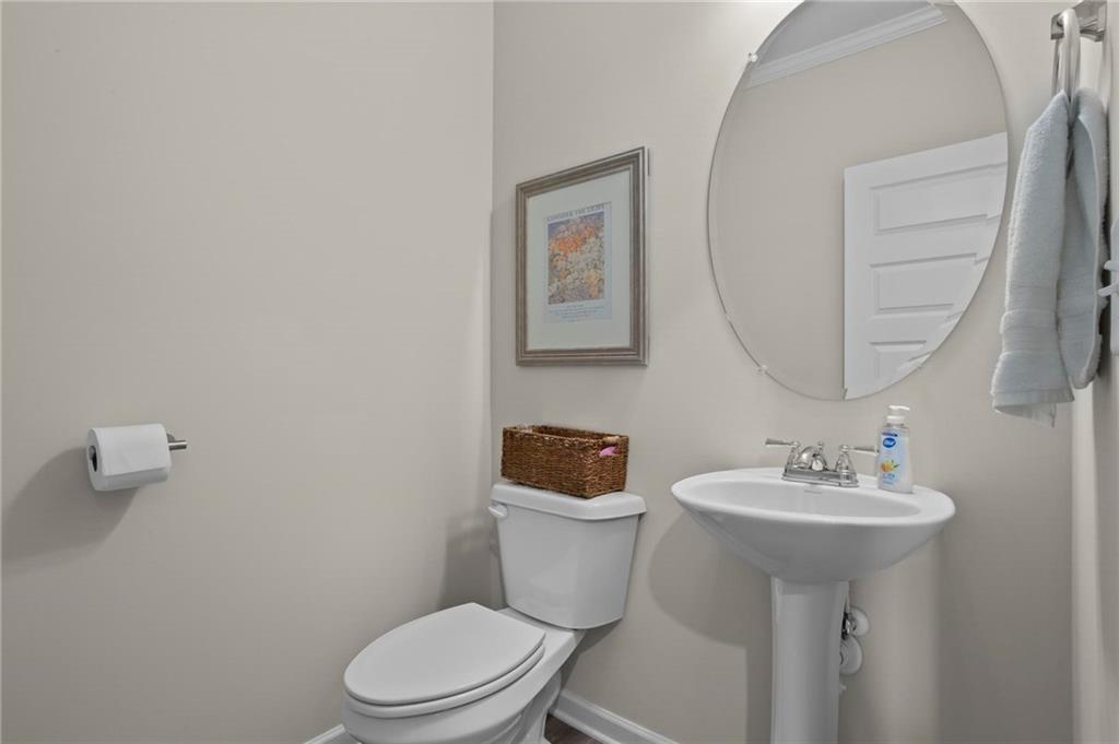217 Eva Way Cartersville, GA 30121 - Photo 15 of 27 a bathroom with a sink toilet and a mirror