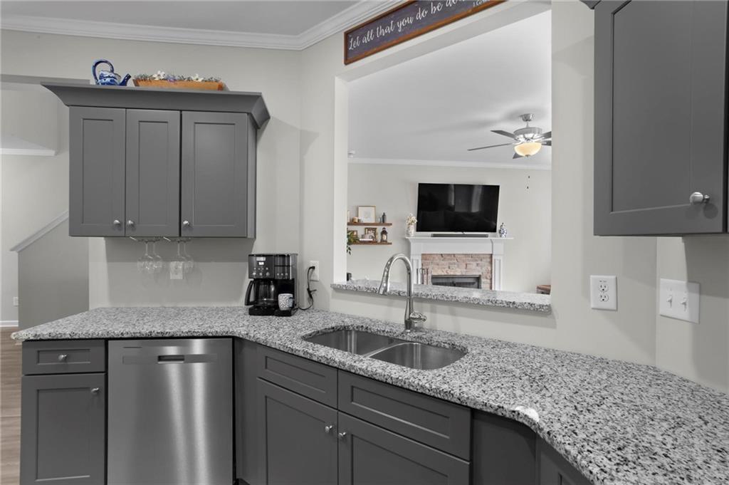 217 Eva Way Cartersville, GA 30121 - Photo 10 of 27 a kitchen with stainless steel appliances granite countertop a sink stove and refrigerator