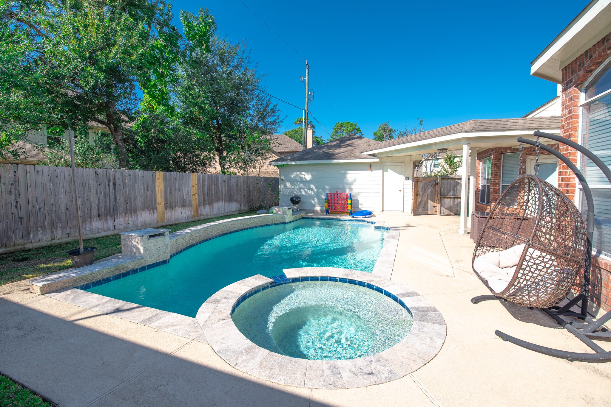 19115 South Rim Trail Spring, TX 77388 - Photo 20 of 21 a view of a house with swimming pool and porch