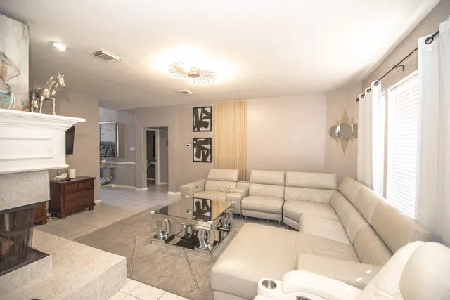 a living room with furniture and a large window