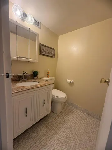 a kitchen with stainless steel appliances a sink and cabinets