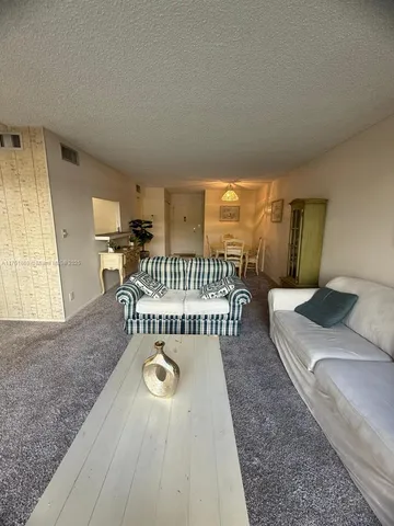 a bedroom with furniture and a wooden floor