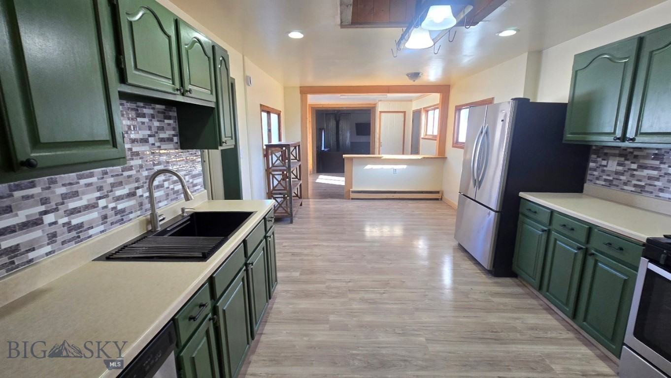 5 Front Street Alder, MT 59710 - Photo 12 of 53 From the Living room enter the Kitchen with room for a dining table in addition to the eat=in pennisula